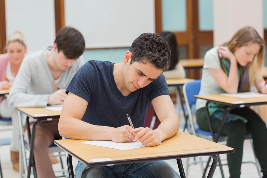 Students taking a test in a classroom in Alameda